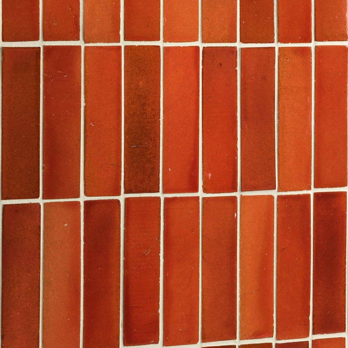 Terracotta-colored stone glaze ceramic imperial red gloss brick tiles with matte finish arranged in vertical rows