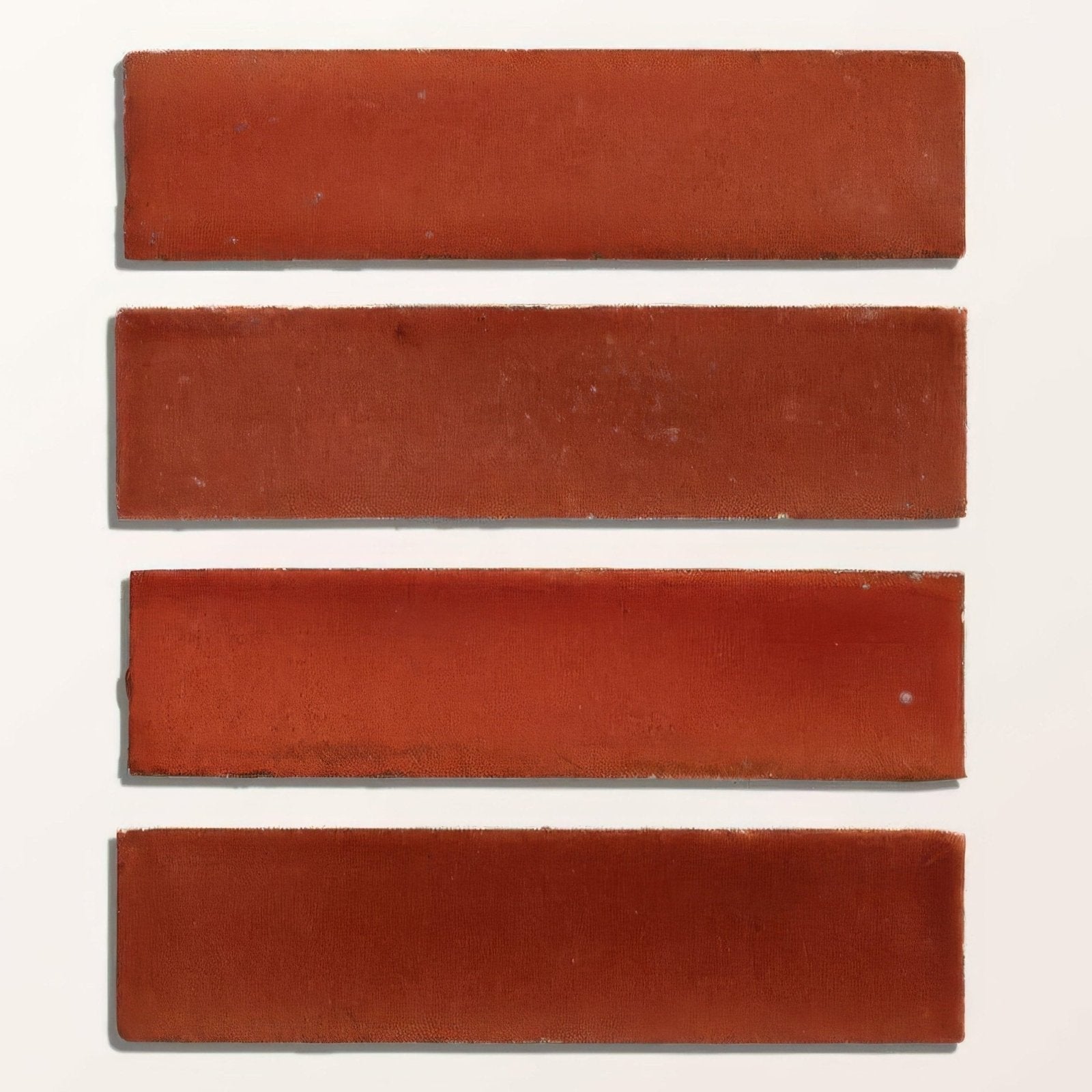 Four rectangular terracotta stone glaze ceramic imperial red matte tiles with slightly uneven edges