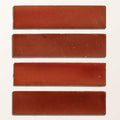 Four rectangular terracotta stone glaze ceramic imperial red matte tiles with slightly uneven edges