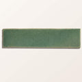 A rectangular matte-finished green stone glaze ceramic menthol gloss brick tile with subtle texture and uneven edges