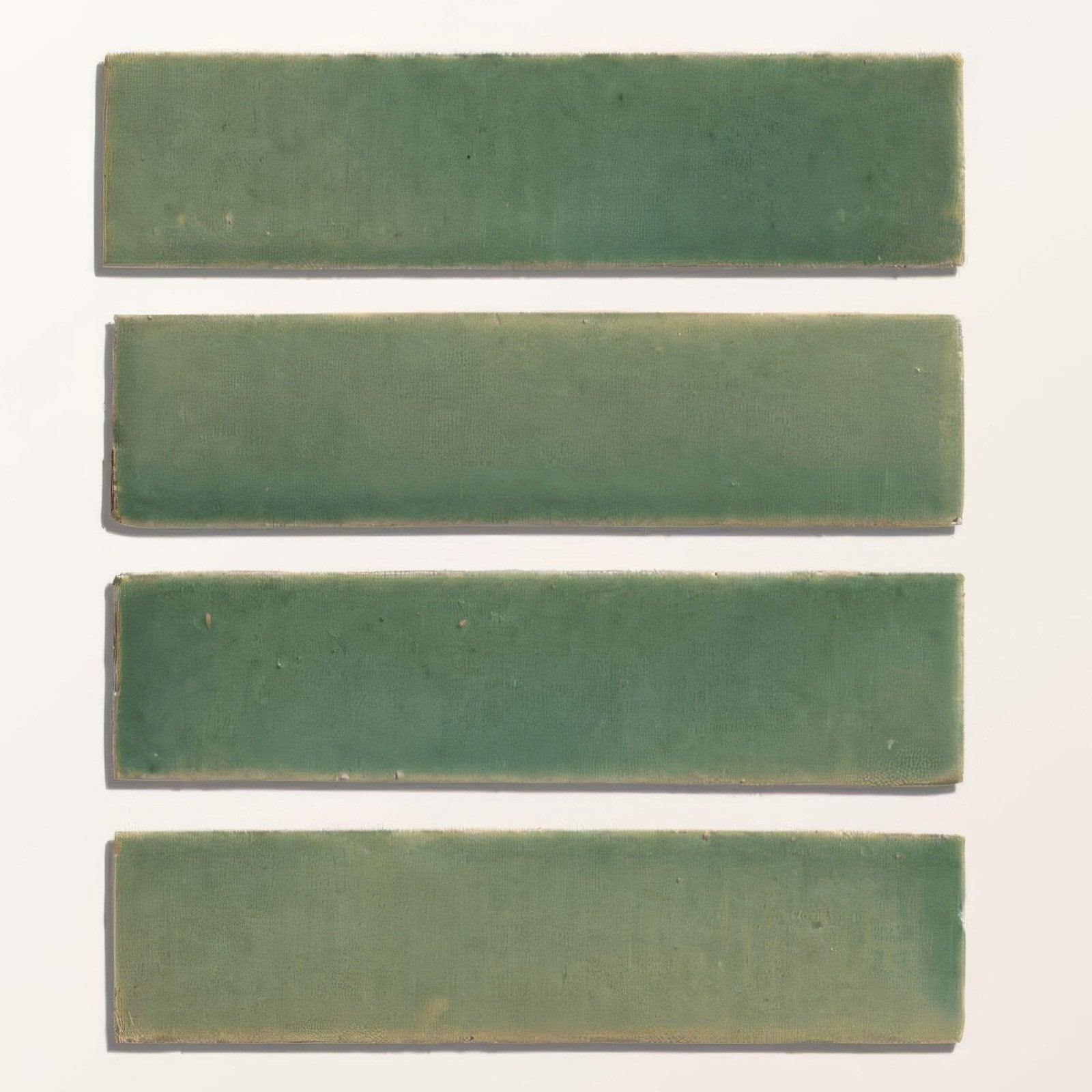 Four rectangular green ceramic tiles with menthol gloss finish from stone glaze ceramic brick collection