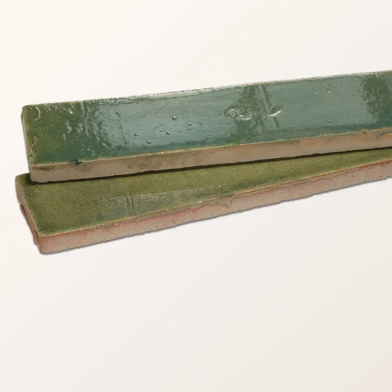 Two stone glaze ceramic olive leaf gloss brick tiles with glossy muted green glaze and earthy unglazed edges