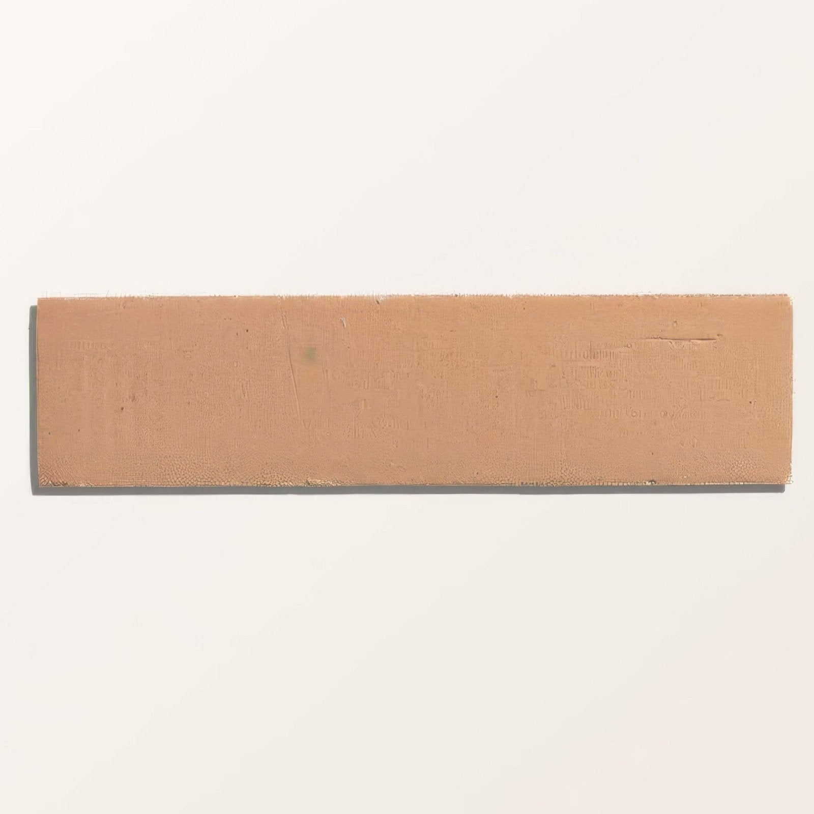 Tan rectangular leather tile with glossy petal design from stone glaze ceramic brick collection