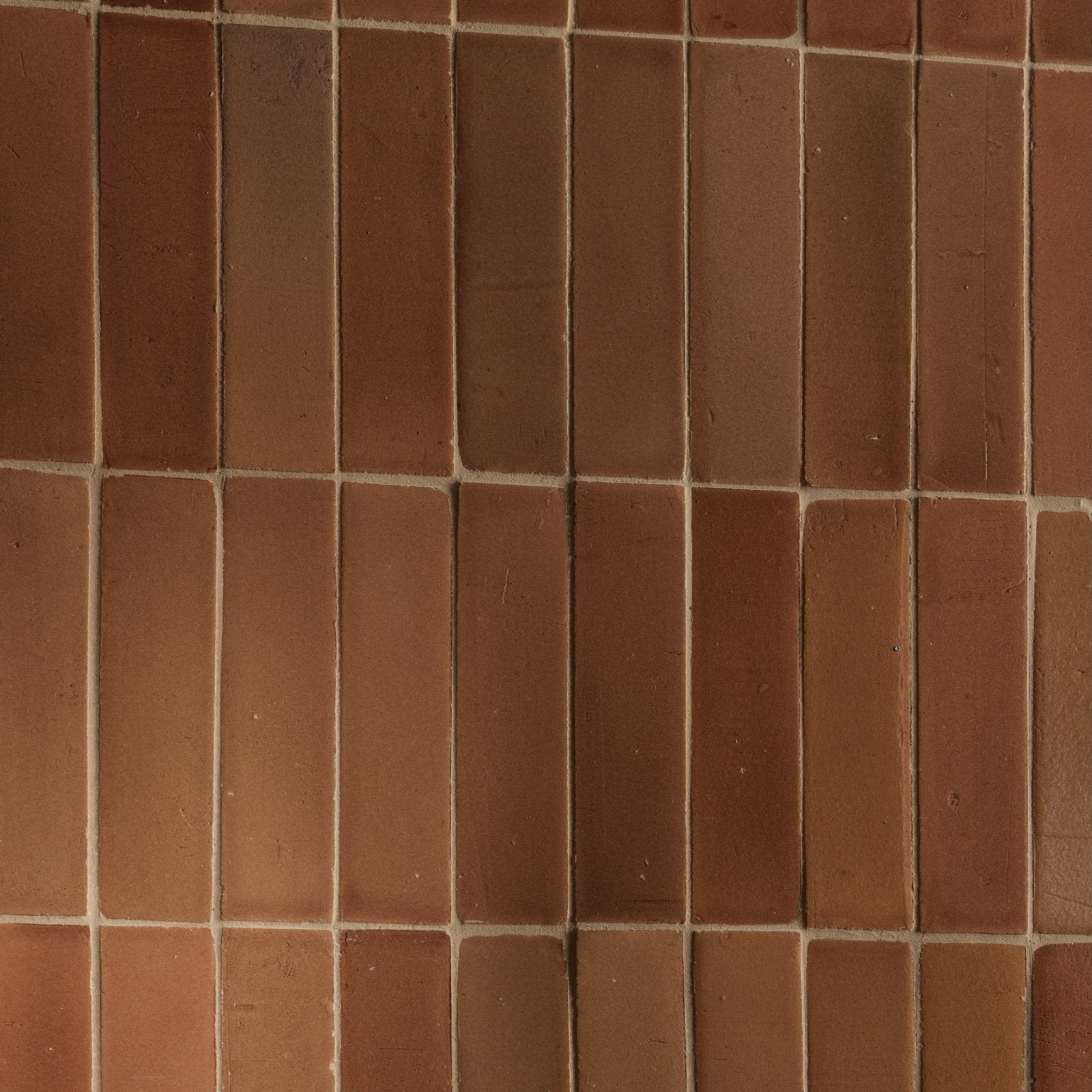 Reddish-brown stone glaze ceramic tan gloss bricks arranged in a rectangular grid with visible mortar lines