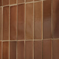Stone glaze ceramic tan gloss brick featuring terracotta rectangular tiles with matte textured finish and beige grout lines