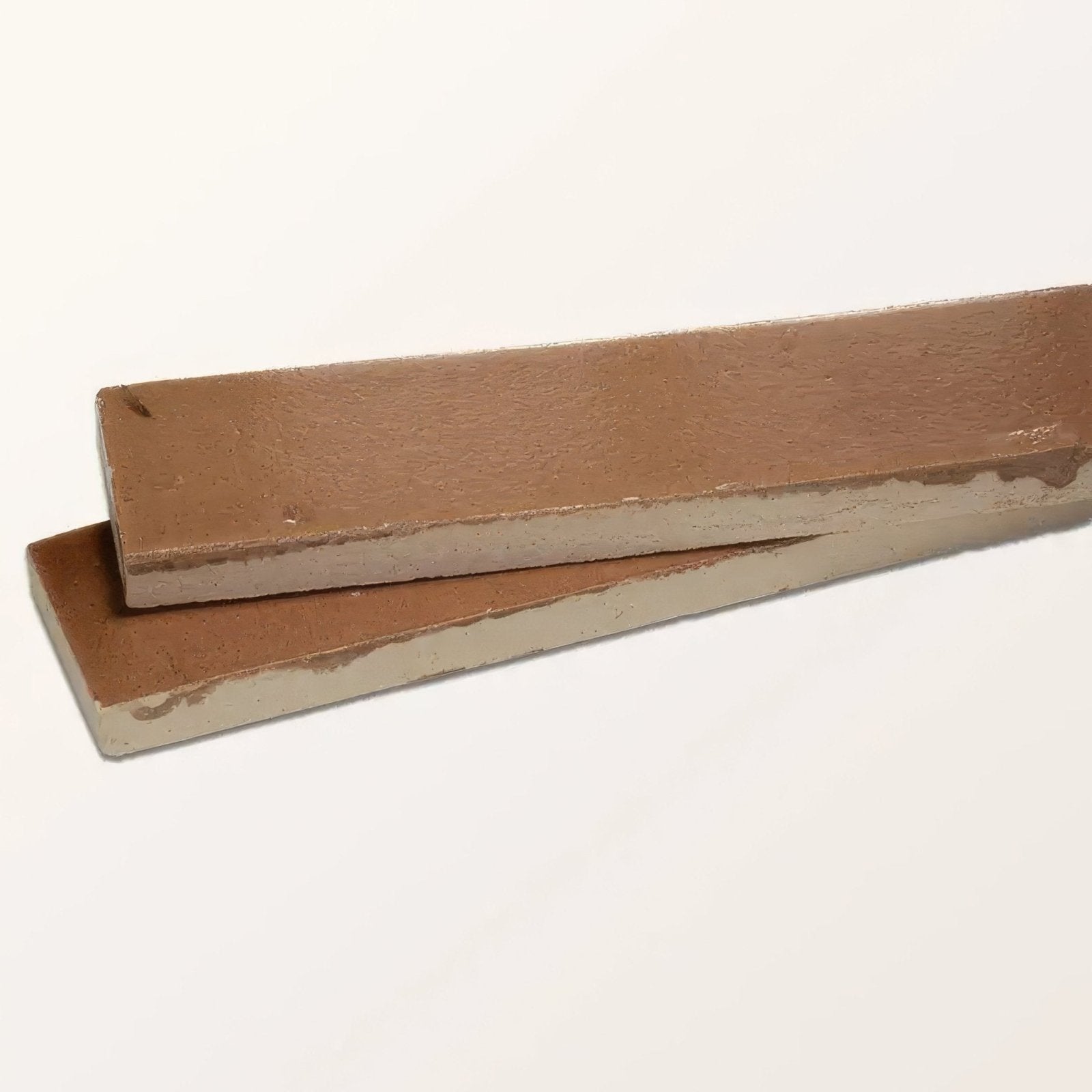 Two rectangular brown concrete slabs with rough texture for stone glaze ceramic tan gloss brick flooring and walls