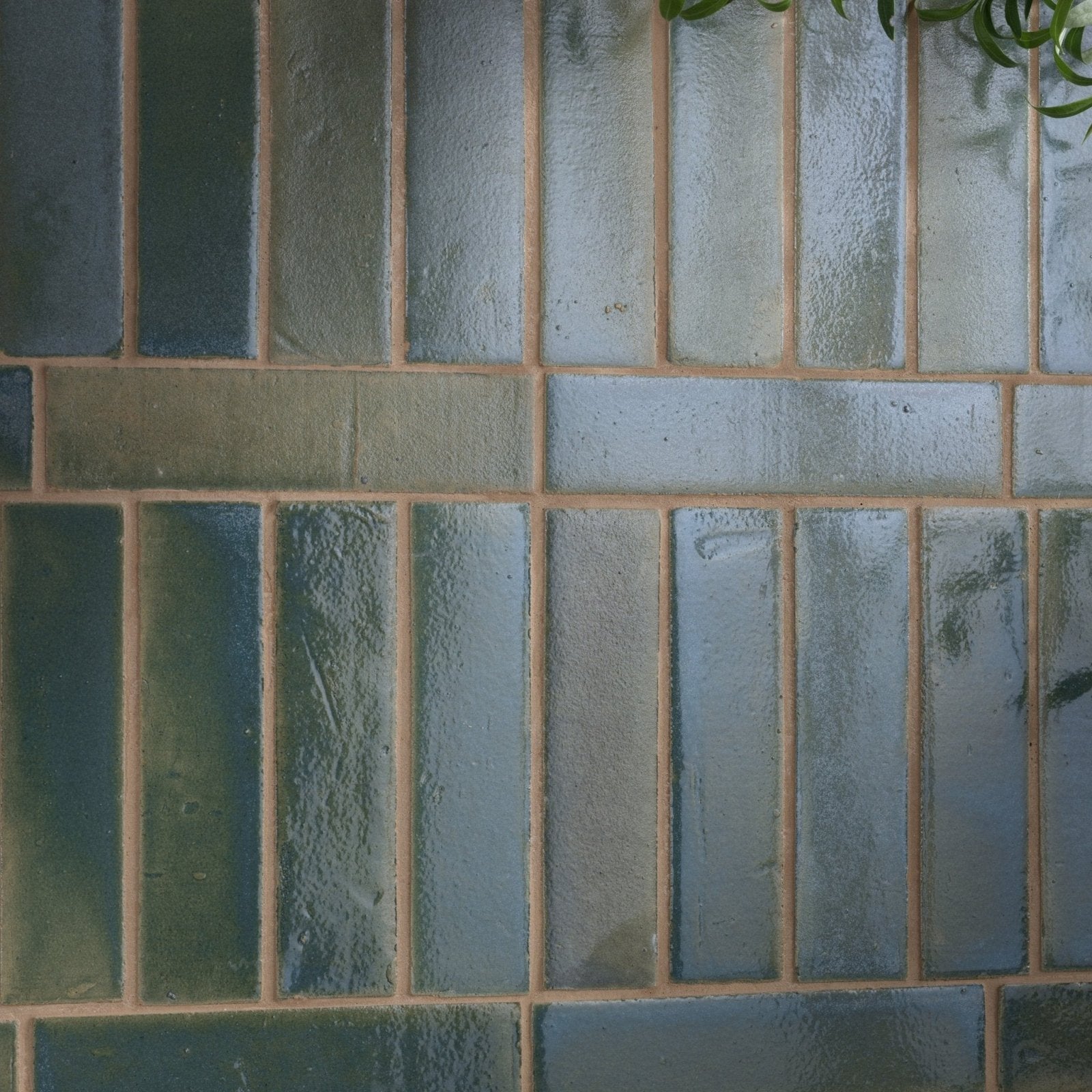 Stone glaze ceramic winter pond gloss brick tile with blue green textured ceramic arranged in a brick pattern with beige grout