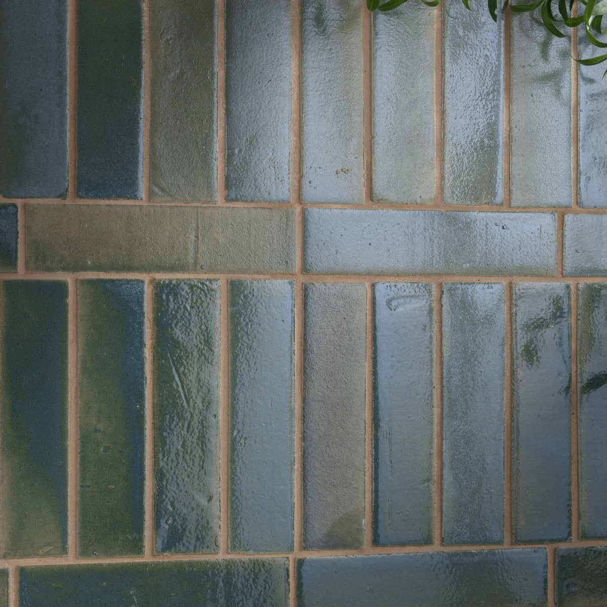 Stone glaze ceramic winter pond gloss brick tile with blue green textured ceramic arranged in a brick pattern with beige grout