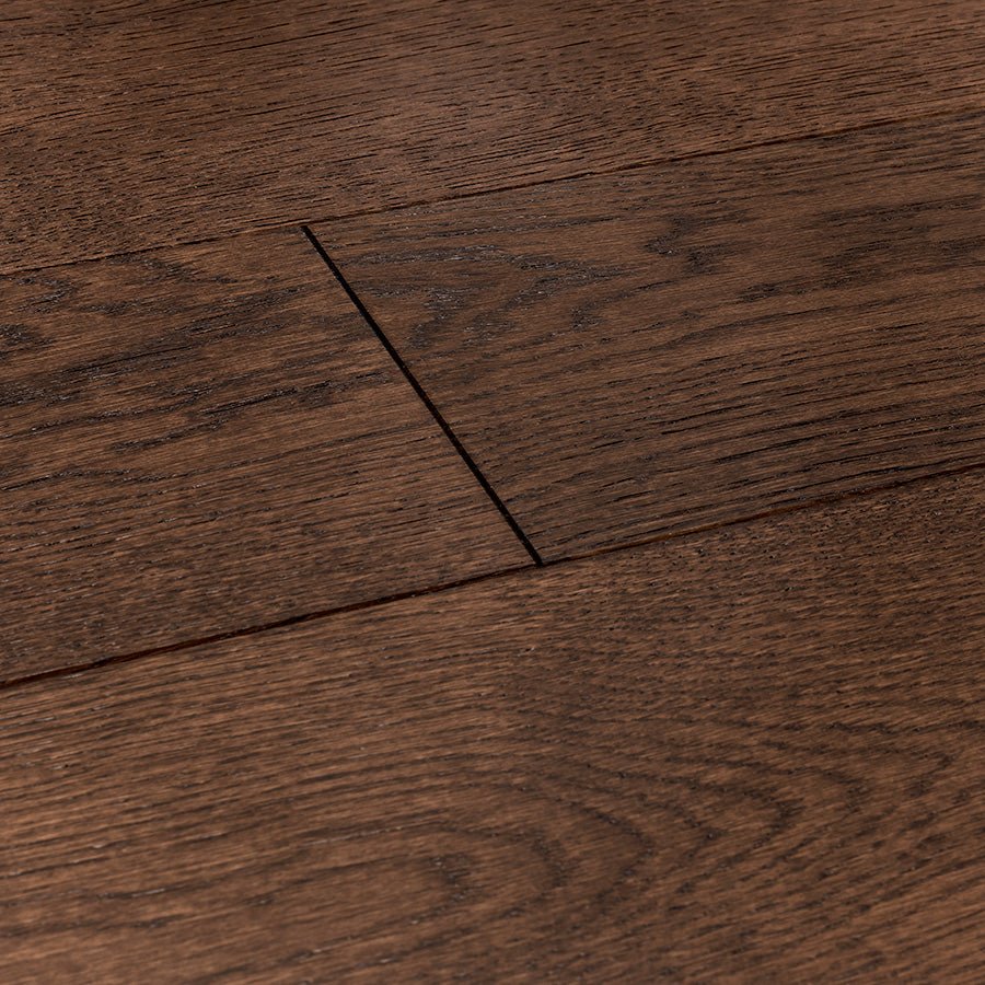 Dark brown hardwood flooring stonehaven brook oak with natural wood grain pattern and visible plank seams