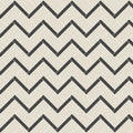 Beige and black herringbone patterned tile flooring from stornoway black and dover white collection