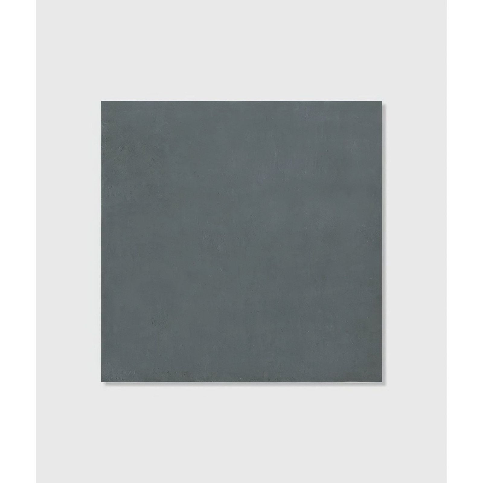 A matte dark gray stucco porcelain textured tile with a subtle surface ideal for modern flooring and walls