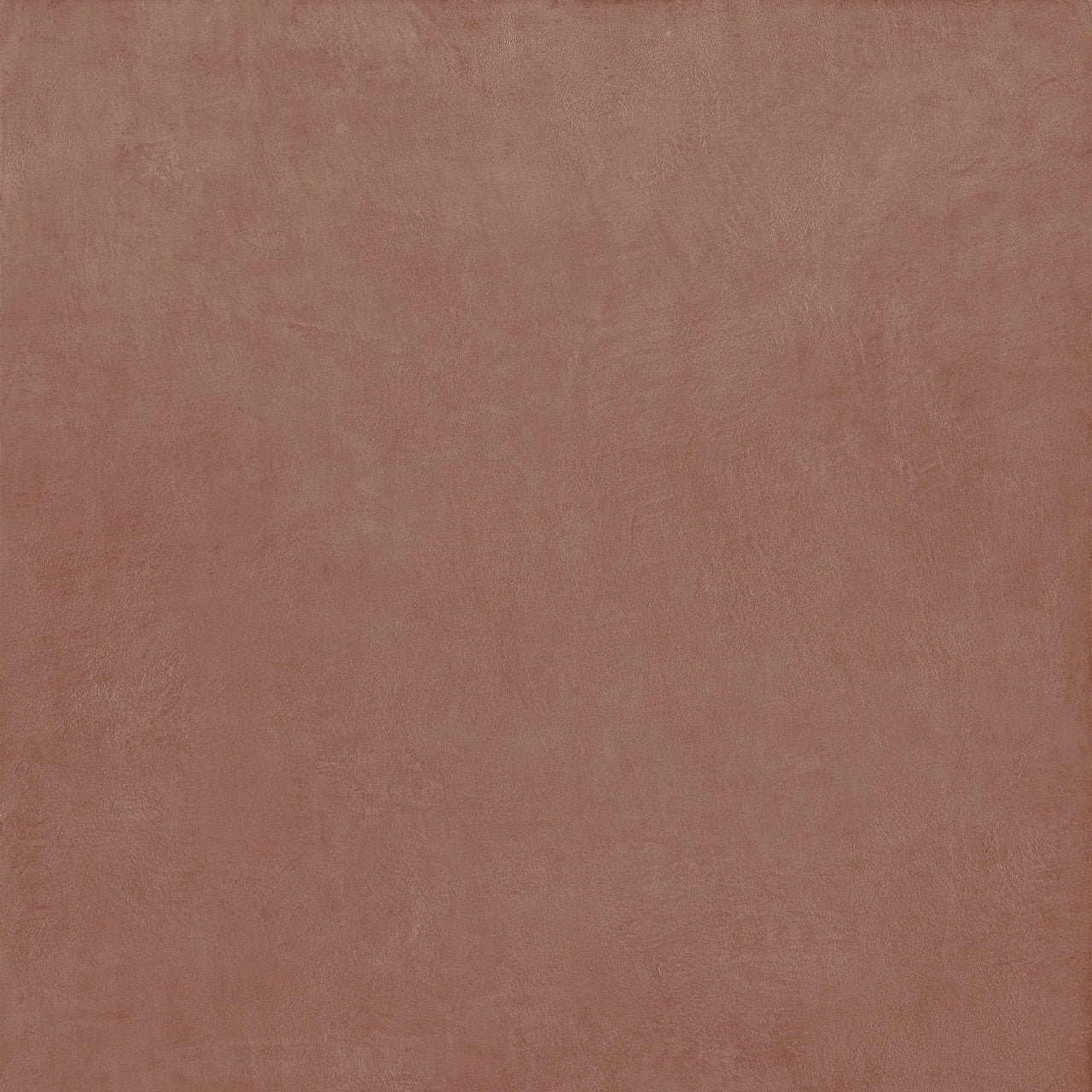 A smooth matte-finished terracotta stucco porcelain tile with subtle texture ideal for flooring and walls
