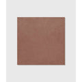 A square matte finished terracotta colored stucco porcelain tile with a subtle textured surface