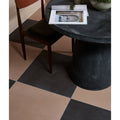 Black and beige checkered stucco porcelain textured tan floor tiles showcasing durable textured surface