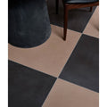 Black and beige checkered stucco porcelain textured umber floor tiles showing durable ceramic surface