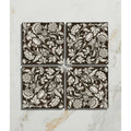 Set of four brown ceramic coasters with intricate white floral and botanical patterns from Studio Assisi brown ceramic