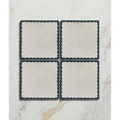Set of four cream ceramic coasters with dark teal scalloped edge from Studio Bobbin Ceramic Blue collection