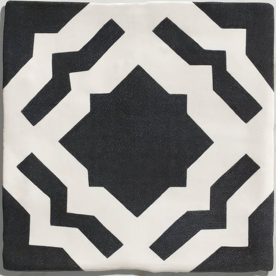 Studio cassius blue ceramic tile with black and white bold symmetrical geometric pattern made of ceramic material