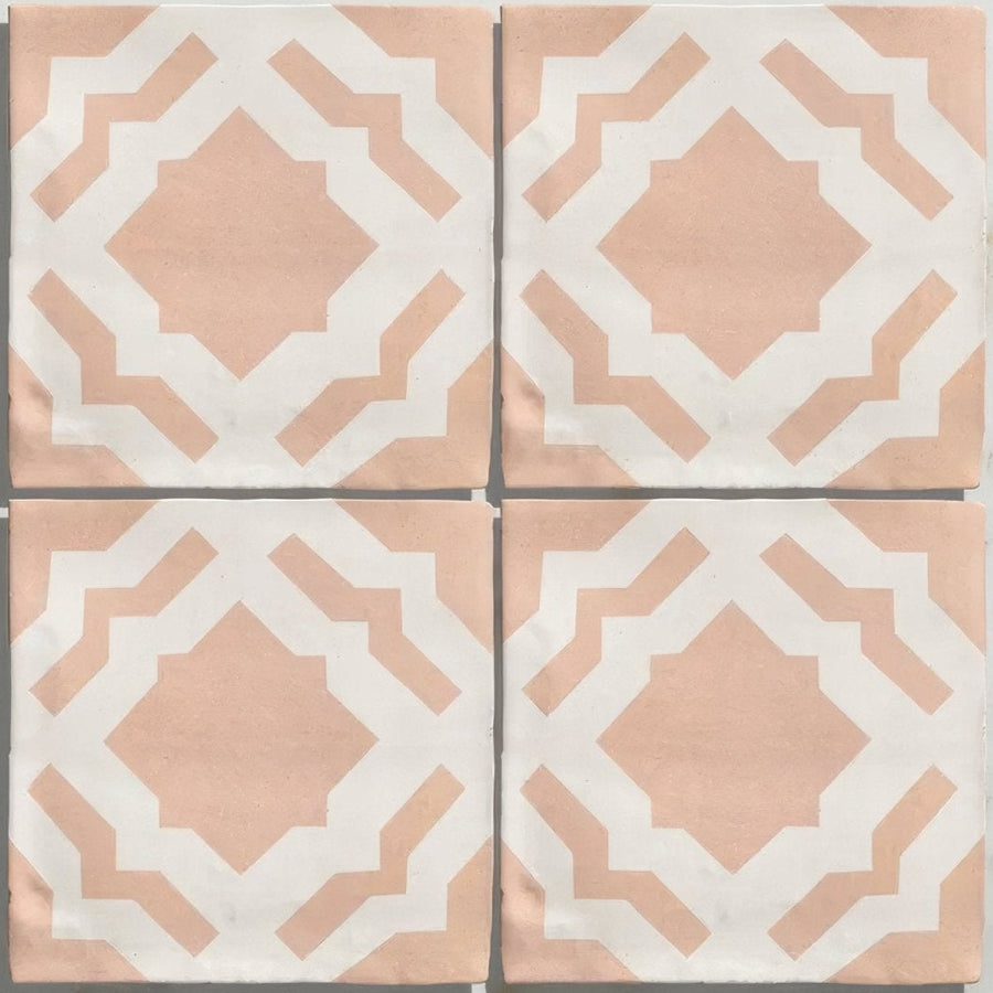 Four square ceramic tiles from studio cassius pink ceramic featuring a soft peach and white geometric pattern