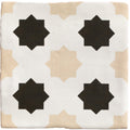 Square ceramic tile with a white beige and black geometric star pattern from studio cosmos sand ceramic collection
