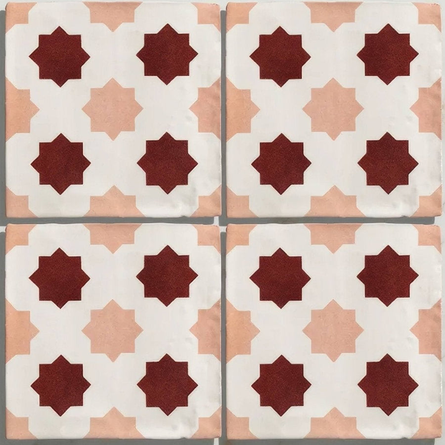 Studio cosmos zagora ceramic four square tiles with deep red and soft peach star geometric pattern on white background