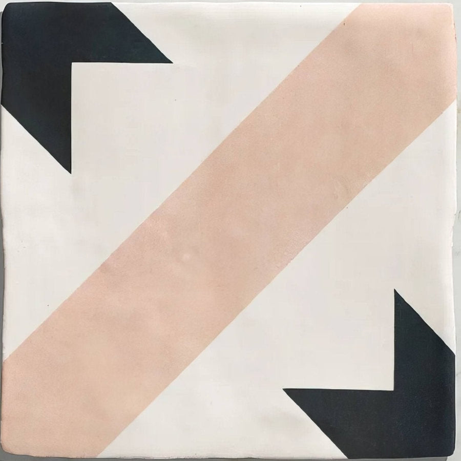 A square studio étoile blue star ceramic tile with bold black arrows and a blush pink stripe on off-white background