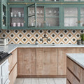 Studio Étoile Brown Star Ceramic geometric star pattern ceramic tile with teal-green kitchen cabinets