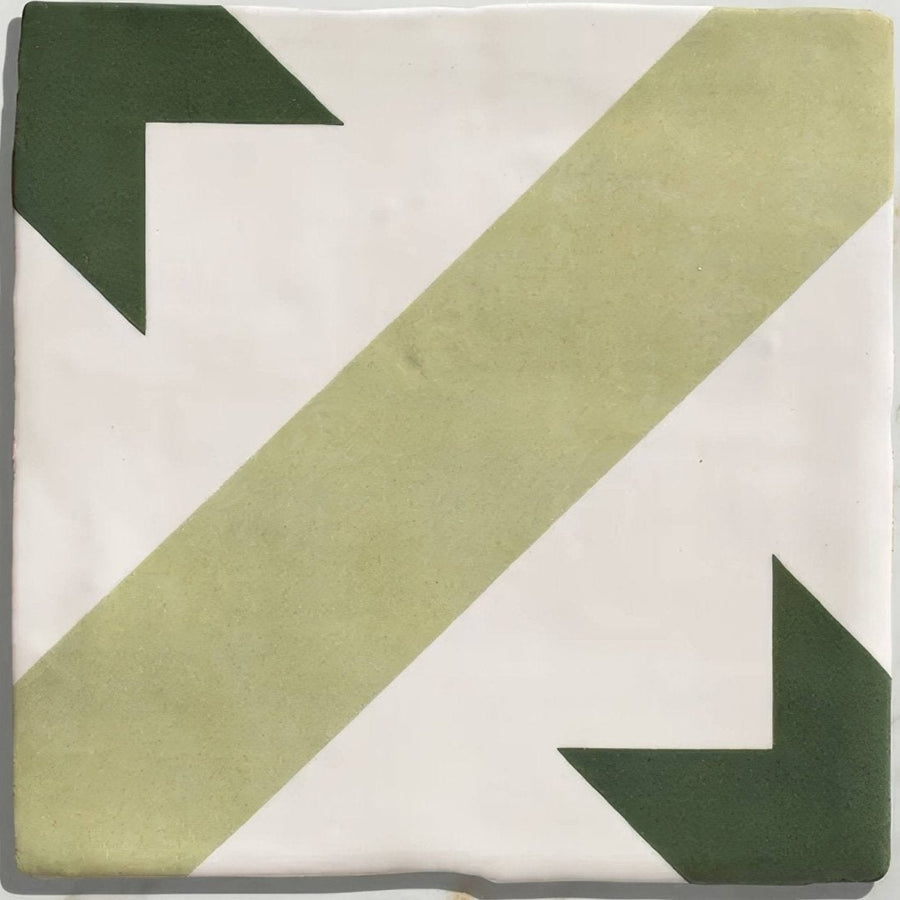 Studio étoile green star ceramic square tile with matte off-white base and muted olive and dark forest green diagonal stripes and arrows