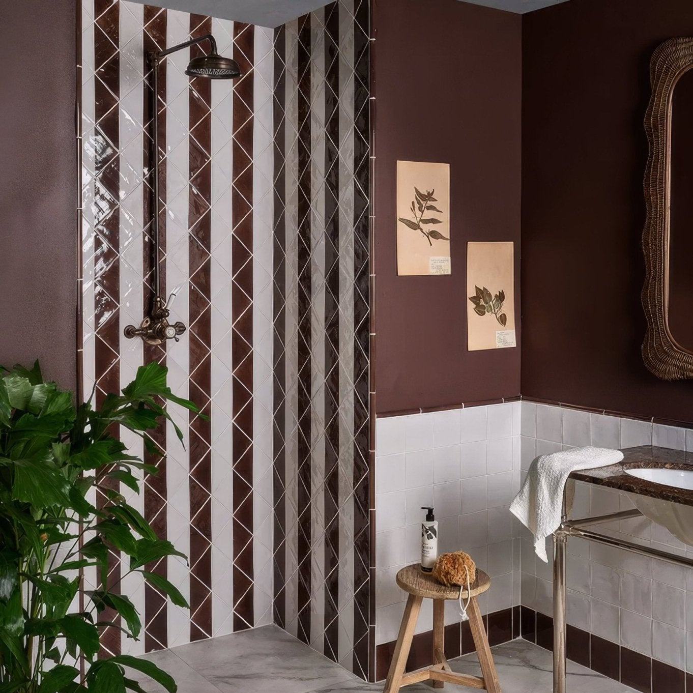 The studio jamboree handpainted ceramic chocolate tri features a dark bronze vintage showerhead with an ornate curved spout