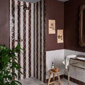 The studio jamboree handpainted ceramic chocolate tri features a dark bronze vintage showerhead with an ornate curved spout
