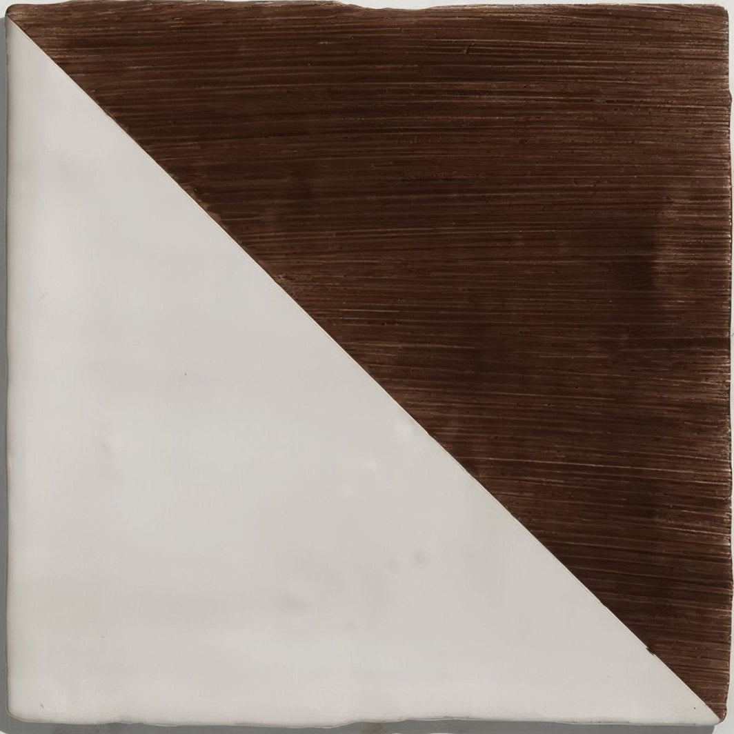 Studio jamboree handpainted ceramic chocolate tri tile with a diagonal split white glaze and textured brown wood grain finish