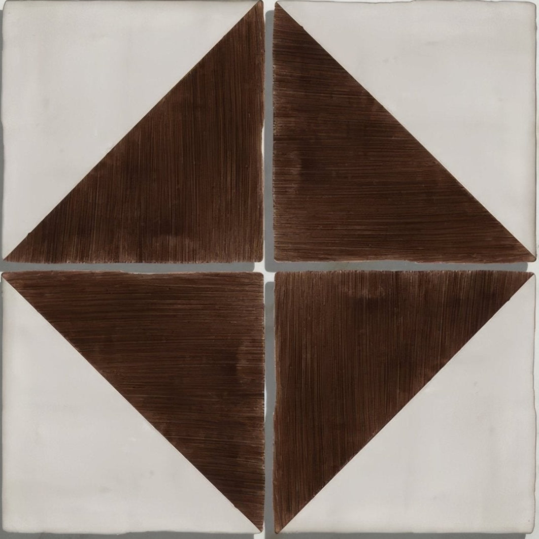 Square ceramic tile with handpainted geometric design featuring four brown triangles in a diamond pattern on white background