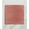 A square terracotta-colored handpainted ceramic tile with subtle horizontal texture from studio jamboree coral field