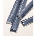 Gray translucent glass tile strips with smooth curved profile and frosted edges from studio jamboree handpainted ceramic denim beading