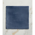 Studio jamboree handpainted ceramic denim field tile in deep blue with subtle horizontal texture and durable finish