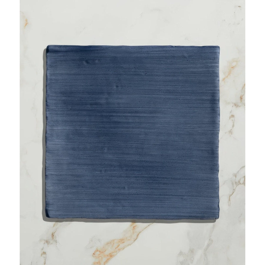 Studio jamboree handpainted ceramic denim field tile in deep blue with subtle horizontal texture and durable finish