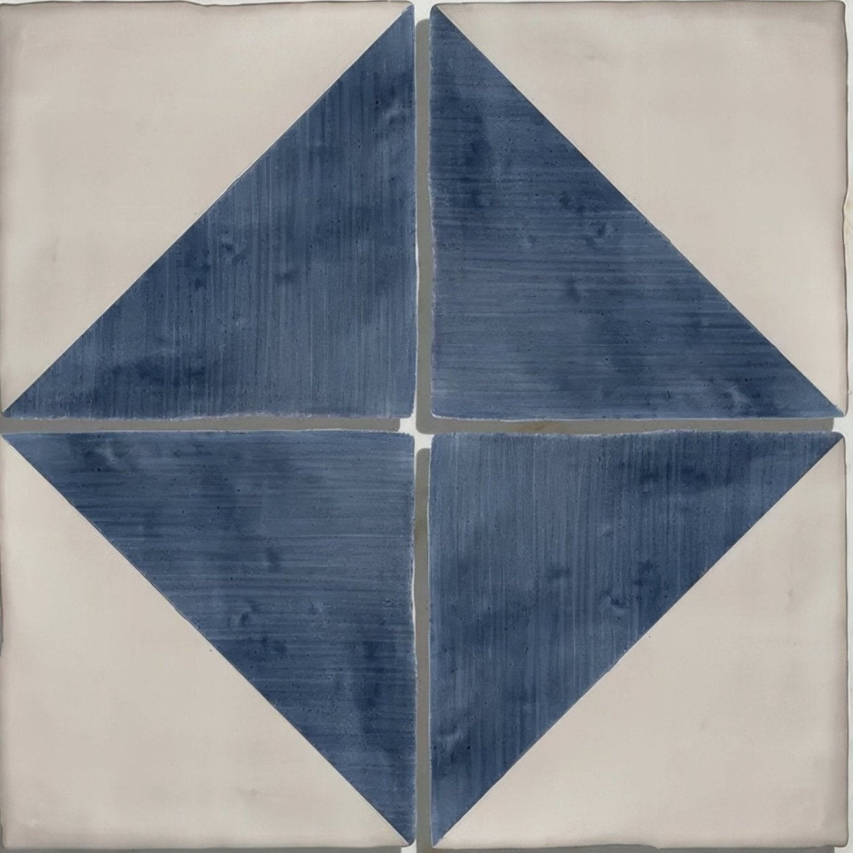Studio jamboree handpainted ceramic tile in blue and white with a geometric diamond pattern for decorative use