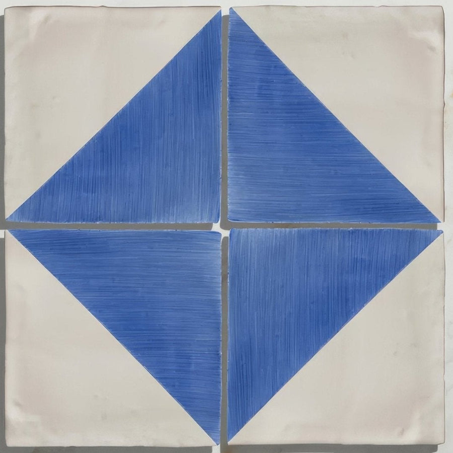 Studio Jamboree handpainted ceramic tile with blue and white geometric diamond pattern and textured brushstroke detailing
