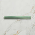 A sleek translucent green studio jamboree handpainted ceramic tile with ribbed texture and smooth edges for thyme beading