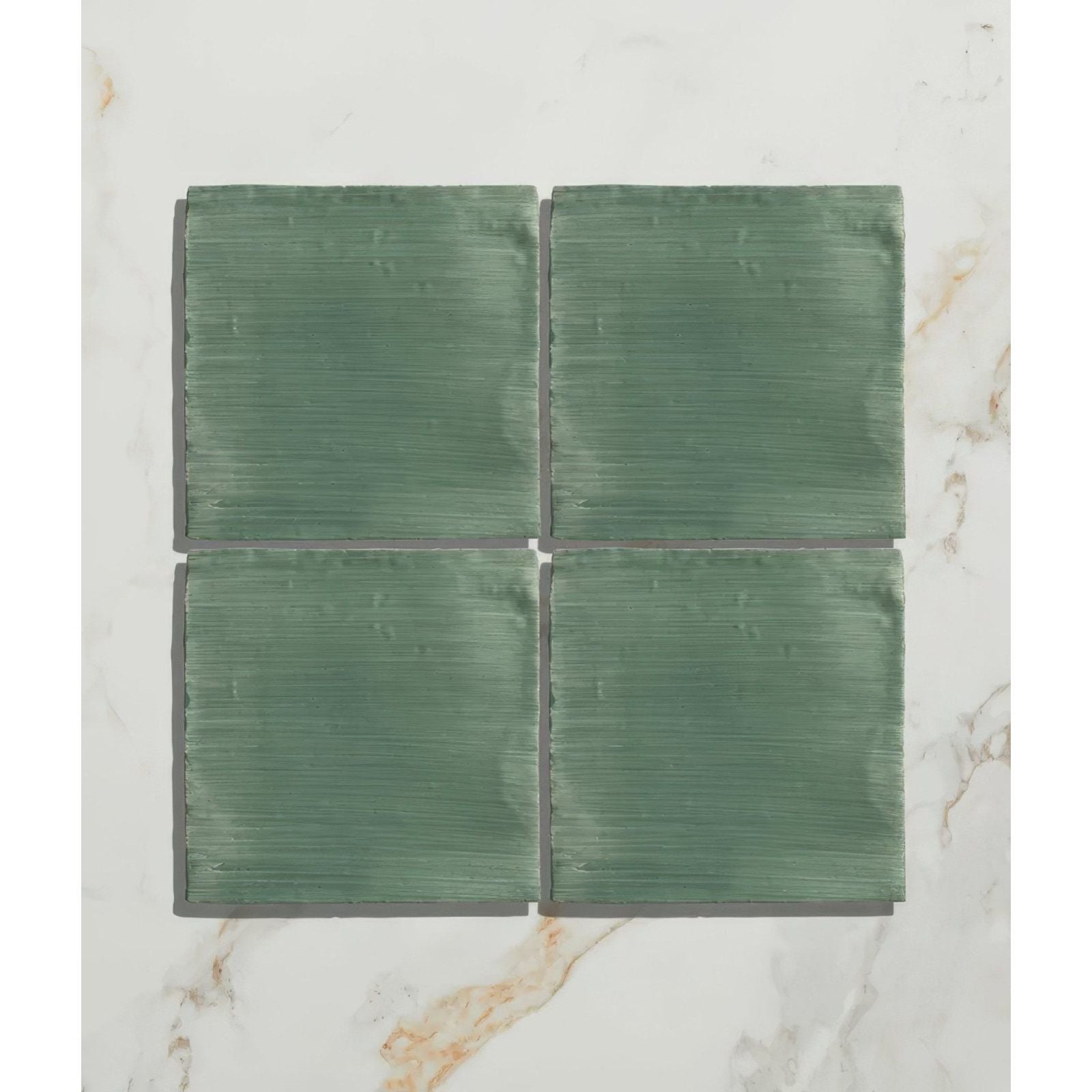 Studio jamboree handpainted ceramic thyme field green square tiles with brushed texture arranged in a grid