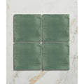 Studio jamboree handpainted ceramic thyme field green square tiles with brushed texture arranged in a grid