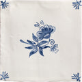 Studio Nonna’s Kitchen Classica ceramic tile cream colored with delicate blue floral and stylized leaf corner design