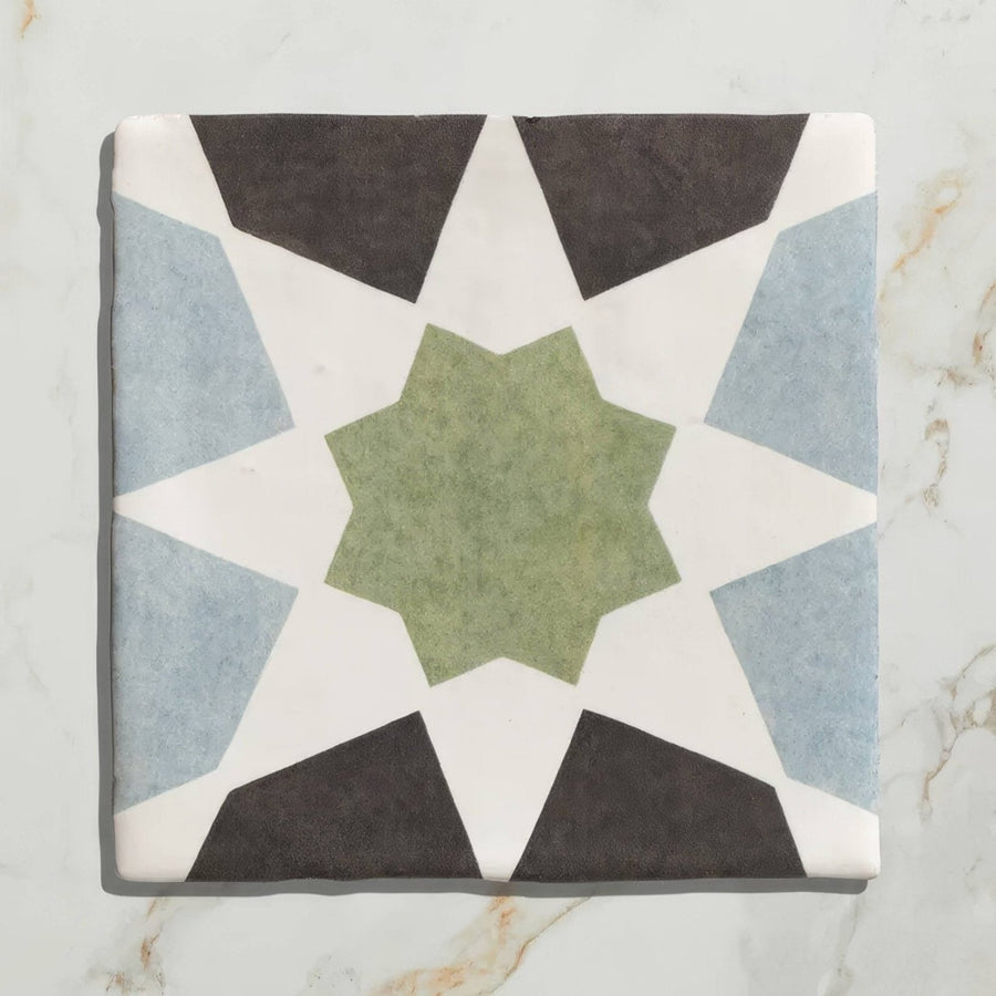 Studio souk green star ceramic square tile with geometric star pattern in muted green light blue and dark gray on white background