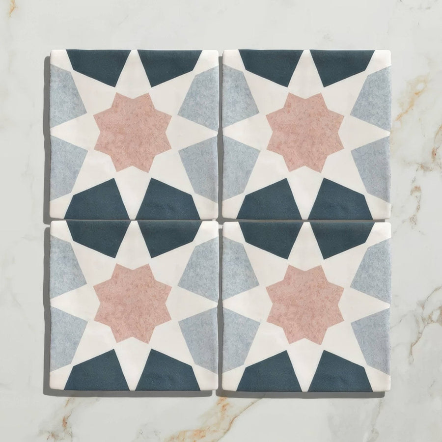 Studio souk pink star ceramic four square tiles with pink star navy blue and gray geometric patterns on white background