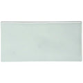 A sleek rectangular ceramic sudbury half tile with smooth glossy surface and soft pale green hue