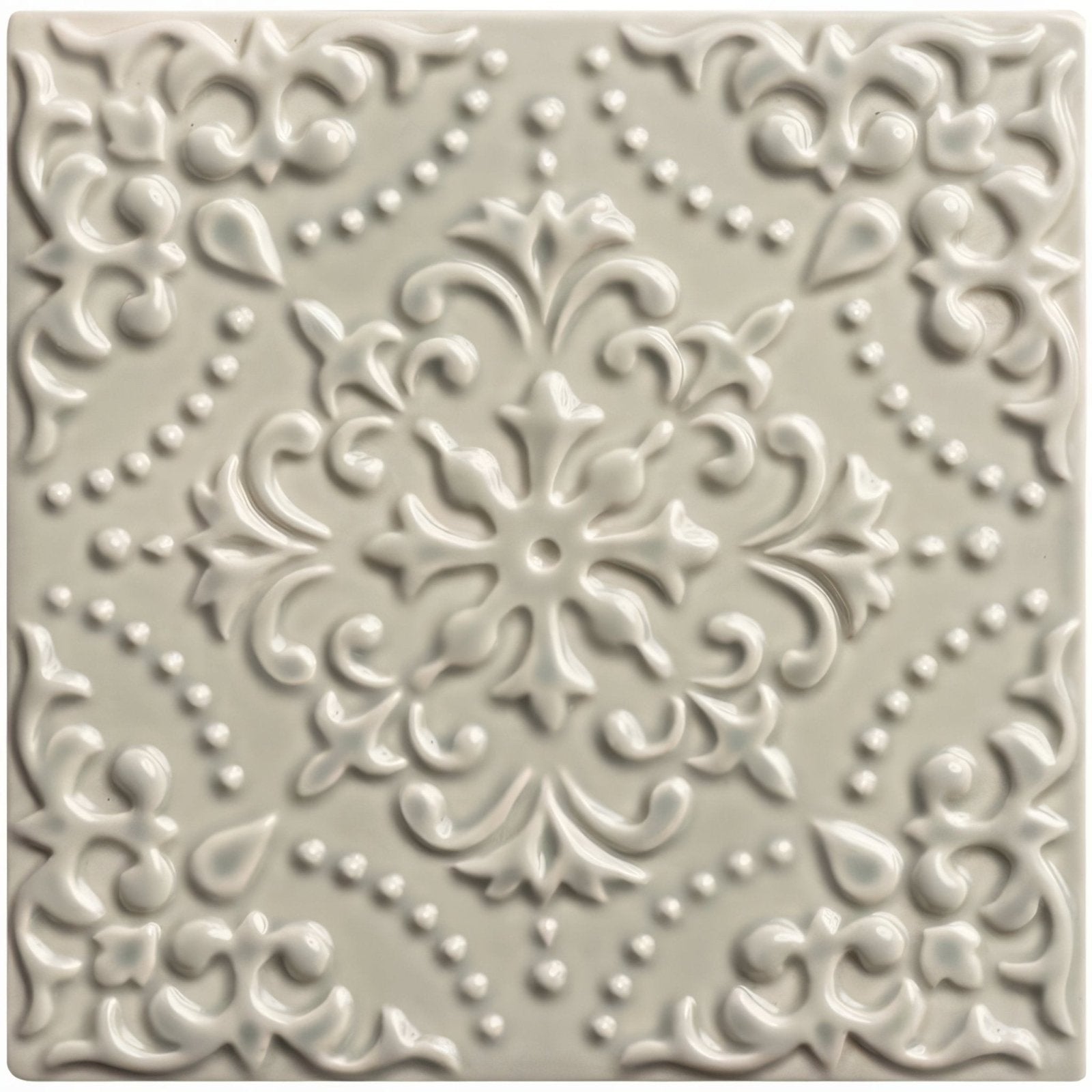 Cream-colored ceramic tile Sudbury Highgrove with raised ornate floral and scrollwork design for decorative use
