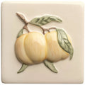 Cream-colored ceramic tile with raised three-dimensional relief of pale yellow peaches green leaves and brown stems