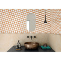 Bronze bowl sink in sunset orange with a matte slightly tarnished finish and rounded edges for bathroom use