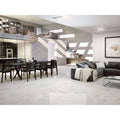 Támesis 1851 White Polished cream marble-effect tiles with a grey sectional sofa