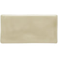 Cream-colored rectangular ceramic tarragon half tile with a smooth glossy finish for wall or backsplash use